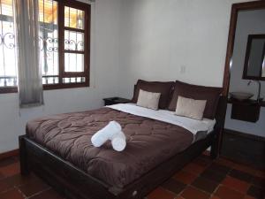 Pantano de Vargas - Hotel Lancers - Paipa Boyacá客房内的一张或多张床位