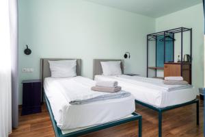 Postel nebo postele na pokoji v ubytování Das Schreder Hotel