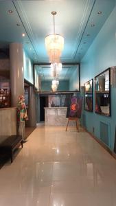 a lobby of a store with a painting on the wall at Hotel Tres Sargentos in Buenos Aires