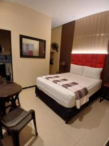 Voodi või voodid majutusasutuse Hotel 50 Suites toas
