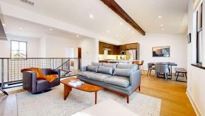 a living room with a couch and a table at Cozy Cabin for 8 Close to Eagle Lodge in Mammoth Lakes