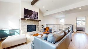 a living room with a couch and a fireplace at Cozy Cabin for 8 Close to Eagle Lodge in Mammoth Lakes