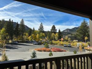 a view of a parking lot from a balcony at Cozy Cabin for 8 Close to Eagle Lodge in Mammoth Lakes +37 photos