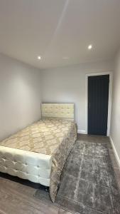 a bedroom with a large bed in a room at Abena' Villa in Moffat
