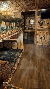 a room with a bed in a wooden cabin at Mała Bawaria in Zakopane +175 photos