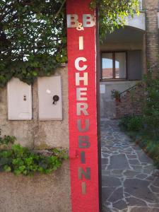 a red sign on the side of a building at B&B I Cherubini in Cislago