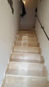 a stairway with wooden steps in a house at B&B La Caldosa in Olbia