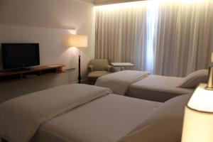 Кровать или кровати в номере K108 Hotel Doha