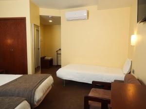 Cama ou camas em um quarto em Hotel São Francisco