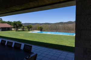 a view of a yard with a swimming pool at Quinta da Estivada in Gondomar