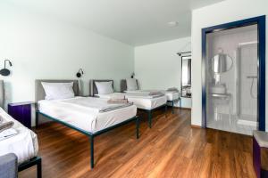 Postel nebo postele na pokoji v ubytování Das Schreder Hotel