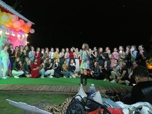 a woman standing on a runway in front of a crowd at Moc's House bắc hà in Bắc Hà