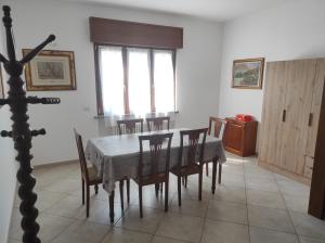 a dining room with a table and chairs at La Mergozzina in Mergozzo +18 photos