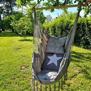 a hammock with an american flag on it at River Point, kuća za odmor in Žažina