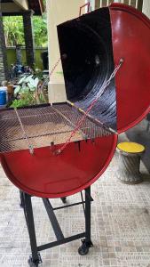a red table with a net on top of it at Ummu Siroj Bachok HOMESTAY in Bachok +9 photos