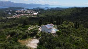 an aerial view of a house on a hill at Solar Hill Home in Žrnovo