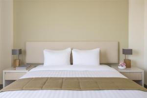 Postel nebo postele na pokoji v ubytování Bristoria Hotel Erbil