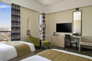 Postel nebo postele na pokoji v ubytování Bristoria Hotel Erbil