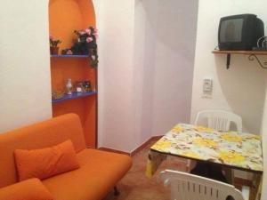 a living room with a couch and a table at Stella Marina in Lampedusa