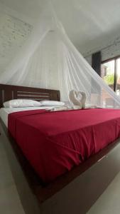 Tempat tidur dalam kamar di Alen's Stay&surf