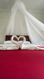 Tempat tidur dalam kamar di Alen's Stay&surf