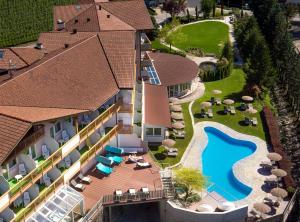 an aerial view of a resort with a swimming pool at Hotel Ifinger in Schenna