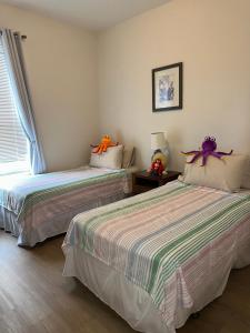 Katil atau katil-katil dalam bilik di Magical Home with private pool and close to parks