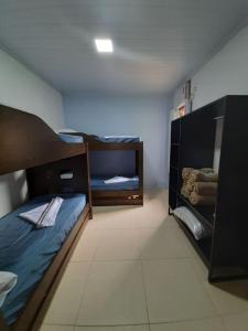 Postel nebo postele na pokoji v ubytování Casa de Temporada Ceu e Mar