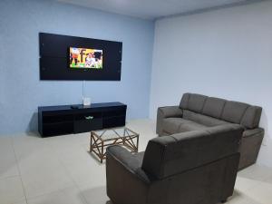 TV a/nebo společenská místnost v ubytování Casa de Temporada Ceu e Mar
