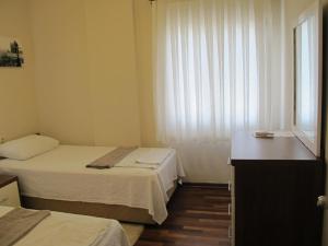 Postel nebo postele na pokoji v ubytování Crescent Villa