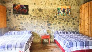 Postel nebo postele na pokoji v ubytování Cabañas Ixaya + 20 fotografií