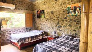 เตียงในห้องที่ Cabañas Ixaya