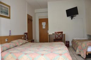 Letto o letti in una camera di Albergo Stazione