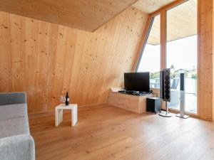 Televiisor ja/või meelelahutuskeskus majutusasutuses Panorama Loft