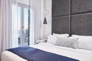 Posteľ alebo postele v izbe v ubytovaní Katikies Villas Mykonos