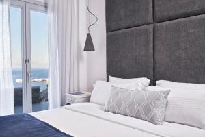 Posteľ alebo postele v izbe v ubytovaní Katikies Villas Mykonos + 37 fotografií