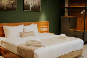 Postel nebo postele na pokoji v ubytování Goland Hotel