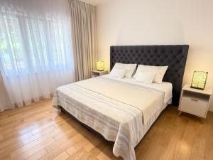 Postel nebo postele na pokoji v ubytování Green Park Apartments