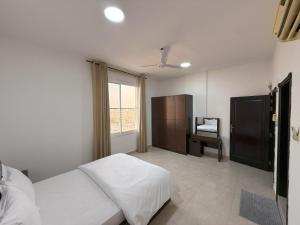 أجنحة هومينج ــ Homing Suites客房内的一张或多张床位