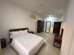 أجنحة هومينج ــ Homing Suites客房内的一张或多张床位