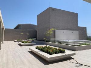 a building with three planters in front of it at Exclusivo Apartamento en Distrito 90 in Barranquilla