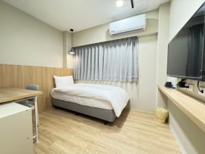 Телевізор і / або розважальний центр в Yoshi Hotel Xinmei Street