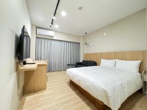 Телевізор і / або розважальний центр в Yoshi Hotel Xinmei Street