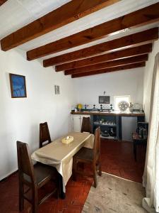 a dining room with a table and chairs at Behind js in Essaouira +15 photos