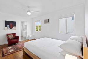 Ένα ή περισσότερα κρεβάτια σε δωμάτιο στο Charming Queenslander Getaway