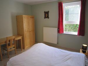 Rúm í herbergi á Contemporary Holiday Home in Houffalize with Private Garden