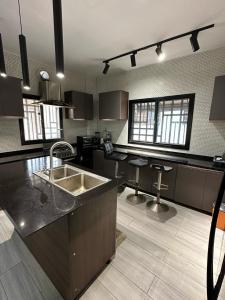 a kitchen with a sink and a counter top at Minteh in Elephant Island