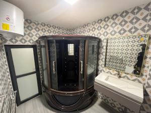 a bathroom with a sink and a mirror at Minteh in Elephant Island +13 photos