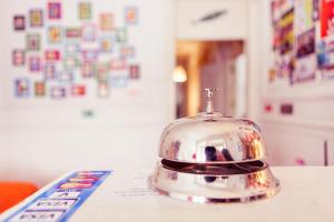 a silver toaster sitting on top of a table at Lisbon Chillout Hostel Privates in Lisbon