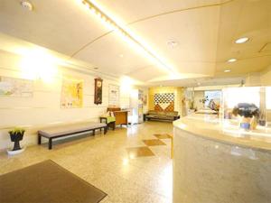 a large lobby with a couch and a waiting room at Hotel Fukui Castle - Vacation STAY 58692v in Fukui